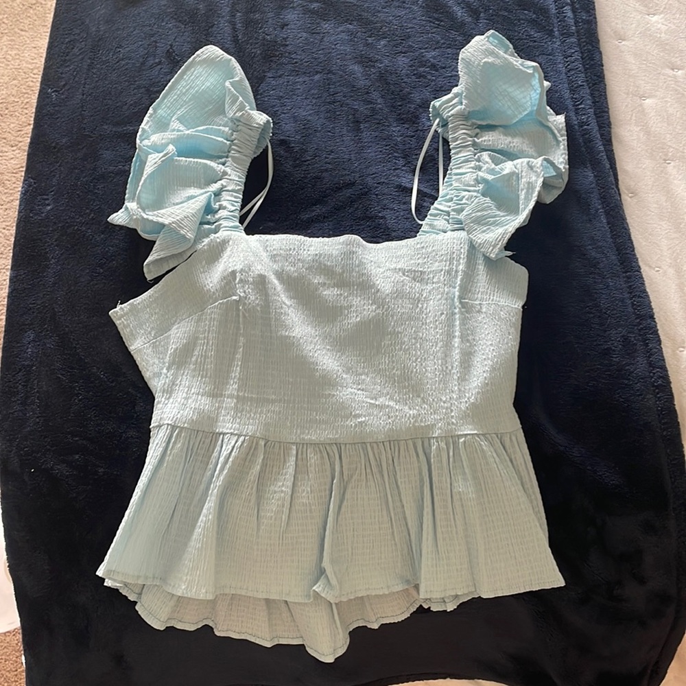 Francesca’s never warn blue bow top